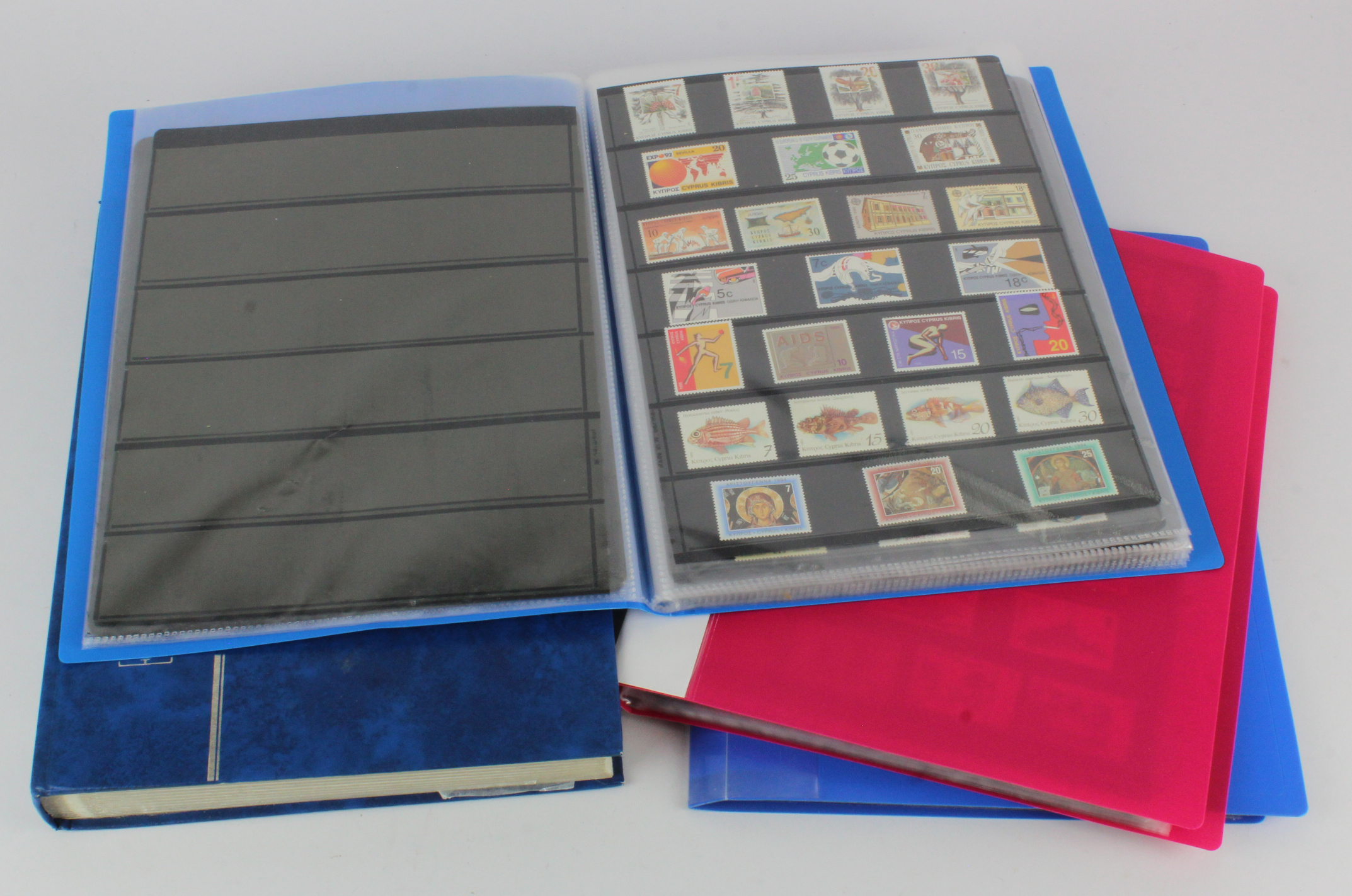 Folders of stamps on stocksheets various, blue stockbook and folder of duplicated mint Russia,