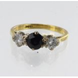 Yellow gold (tests 18ct) diamond and sapphire trilogy ring, one round sapphire approx. 5mm, two