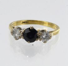 Yellow gold (tests 18ct) diamond and sapphire trilogy ring, one round sapphire approx. 5mm, two