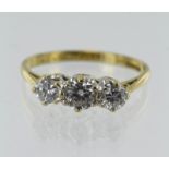 18ct yellow gold diamond trilogy ring, three graduating round brilliant cuts, principle approx. 0.