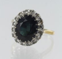 Yellow gold (tests 18ct) diamond and sapphire cluster green, greenish blue sapphire measures 12mm