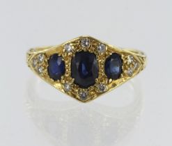 18ct yellow gold diamond and sapphire dress ring, three graduating oval sapphires, principle