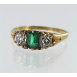 Yellow gold (tests 18ct) vintage emerald and diamond trilogy ring, one step cut emerald measuring