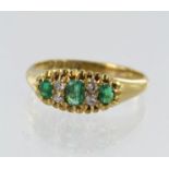 18ct yellow gold Victorian diamond and emerald ring, three graduating step cut emeralds principle