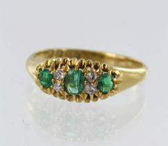 18ct yellow gold Victorian diamond and emerald ring, three graduating step cut emeralds principle