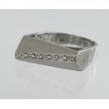 18ct white gold contemporary diamond dress ring, eight single cuts, TDW approx. 0.04ct, head