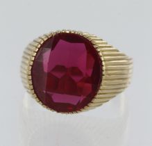 18ct yellow gold synthetic ruby signet ring, checker cut syn. ruby measures 16mm x 14mm, finger size