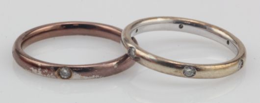 Two white gold (tests 18ct) diamond rings, to include a band with six Roman set diamonds, TDW