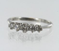 White gold (tests 18ct) diamond five stone ring, five graduating old cut diamonds, TDW approx. 0.