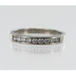 Palladium diamond half eternity ring, nine round brilliant cut diamonds TDW approx 0.31ct, channel