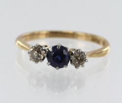 Yellow gold (tests 18ct) diamond and synthetic sapphire trilogy ring, syn. sapphire measures approx.