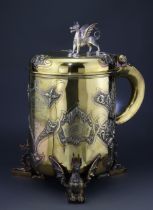 Tankard. A very large exquisite Victorian tankard trophy by Garrard, raised on three dragon feet,