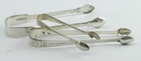 Three pairs of silver sugar tongs, comprising two Georgian pairs - one is bright cut and