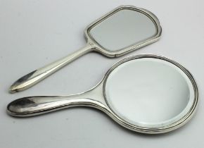 Two silver engine - turned hand mirrors, hallmarked for Birmingham, 1926 and 1956.