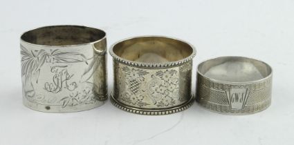 Three silver napkin rings, two bear British hallmarks for Sheffield 1897 & London 1935. The other