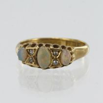 18ct yellow gold vintage diamond and opal boat shaped ring, principle opal measures 5.5mm x 3.5mm,