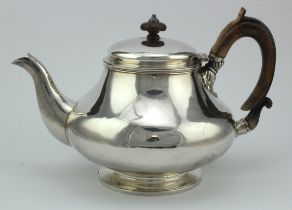 George IV silver teapot with worn wooden handle and wooden finial, bears worn hallmarks for Robert