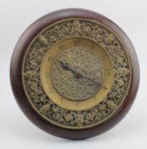 Brass ornately decorated clock, engraved 'Russells, 35 Piccadilly W.', Arabic numerals, easel