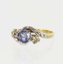 Yellow gold (tests 18ct) diamond and sapphire trilogy ring, one round cornflower blue sapphire