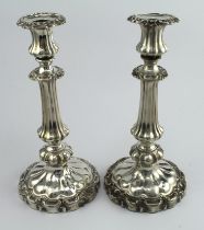 Pair of William IV ornately decorated silver candlesticks, hallmarked 'TJNC, Sheffield 1832' (