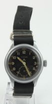 Timor British military issue 'Dirty Dozen' wristwatch. The black dial with white Arabic numerals,