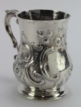 Early 18th c. silver tankard with later embossing, the hallmarks are very worn but they stand for