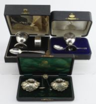Three silver boxed items, comprising two silver Christening sets, egg cup and teaspoon, and egg cup,