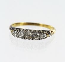 Yellow gold (tests 18ct) diamond boat shaped ring, five graduating old cut and single cut