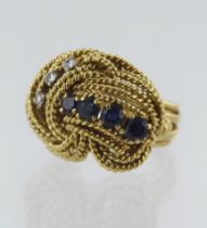 18ct yellow gold diamond and sapphire knot ring, three round brilliant cut diamonds TDW approx. 0.