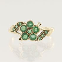 Yellow gold (tests 9ct emerald cluster dress ring, set with twelve variously sized round emeralds,