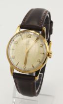 Gents 9ct cased Tudor manual wind wristwatch, hallmarked 1957. The cream dial with alternating