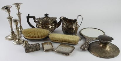 Mixed Silver. A collection of hallmarked silver, including, teapot, cream jug, cigarette cases,
