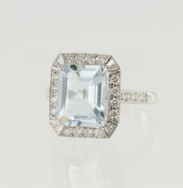 White gold (tests 18ct) diamond and aquamarine cocktail ring, one octagon step cut aquamarine