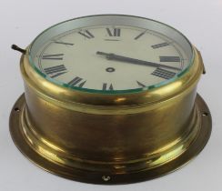 Brass bulkhead clock, Roman numerals to dial, diameter 22.5cm approx. (working at time of