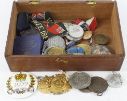 Wooden box containing commemorative coins medals and tokens relating to royalty. (qty) Buyer