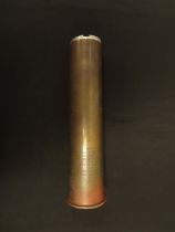 1918 dated brass shell case with its original alloy end cap with enrgraved dedication presented to -