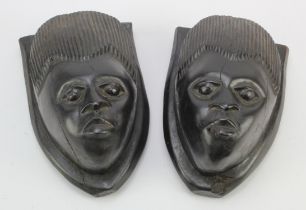 Tribal interest. Two tribal carved African figural plaques, circa early 20th Century, height 18cm
