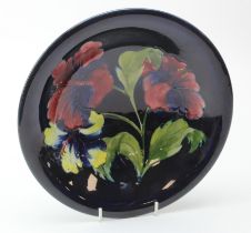 Moorcroft 'Hibiscus' pattern bowl, makers marks and paper label to base, diameter 24.5cm, height 5.