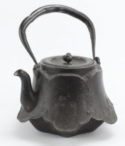Japanese Tetsubin cast iron kettle, with figural decoration to side, marks to base and to inside