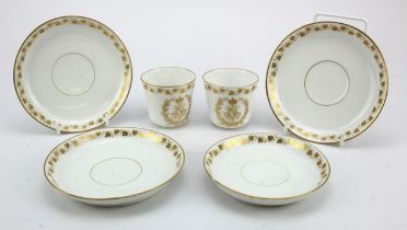 Sevres. A group of two Sevres coffee cups & four Sevres saucers, coffee cup with gilt monogram for