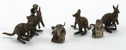 Four unusual Lead figures depicting kangaoos and aboriginals, tallest 55mm approx., plus two painted