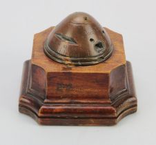 German WWI fuse head desk piece, stamped 'Dopp. Z. K. 91', mounted on a mahogany base, height