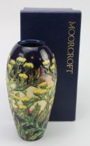 Moorcroft Pottery 'Tansy' pattern vase, makers marks to base, height 19cm approx., contained in