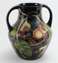 Moorcroft Pottery large 'Anna Lily' pattern twin handled vase, makers marks to base, height 26cm