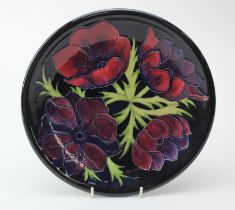 Moorcroft 'Anemone' pattern plate, makers marks to reverse, diameter 26cm approx.