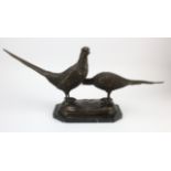 Pair of spelter pheasants, mounted on a marble base, unsigned, total height 30cm, length 65cm, depth