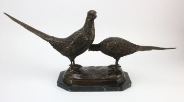 Pair of spelter pheasants, mounted on a marble base, unsigned, total height 30cm, length 65cm, depth