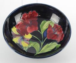 Moorcroft 'Hibiscus' pattern bowl, makers marks and paper label to base, diameter 24cm, height 7.5cm