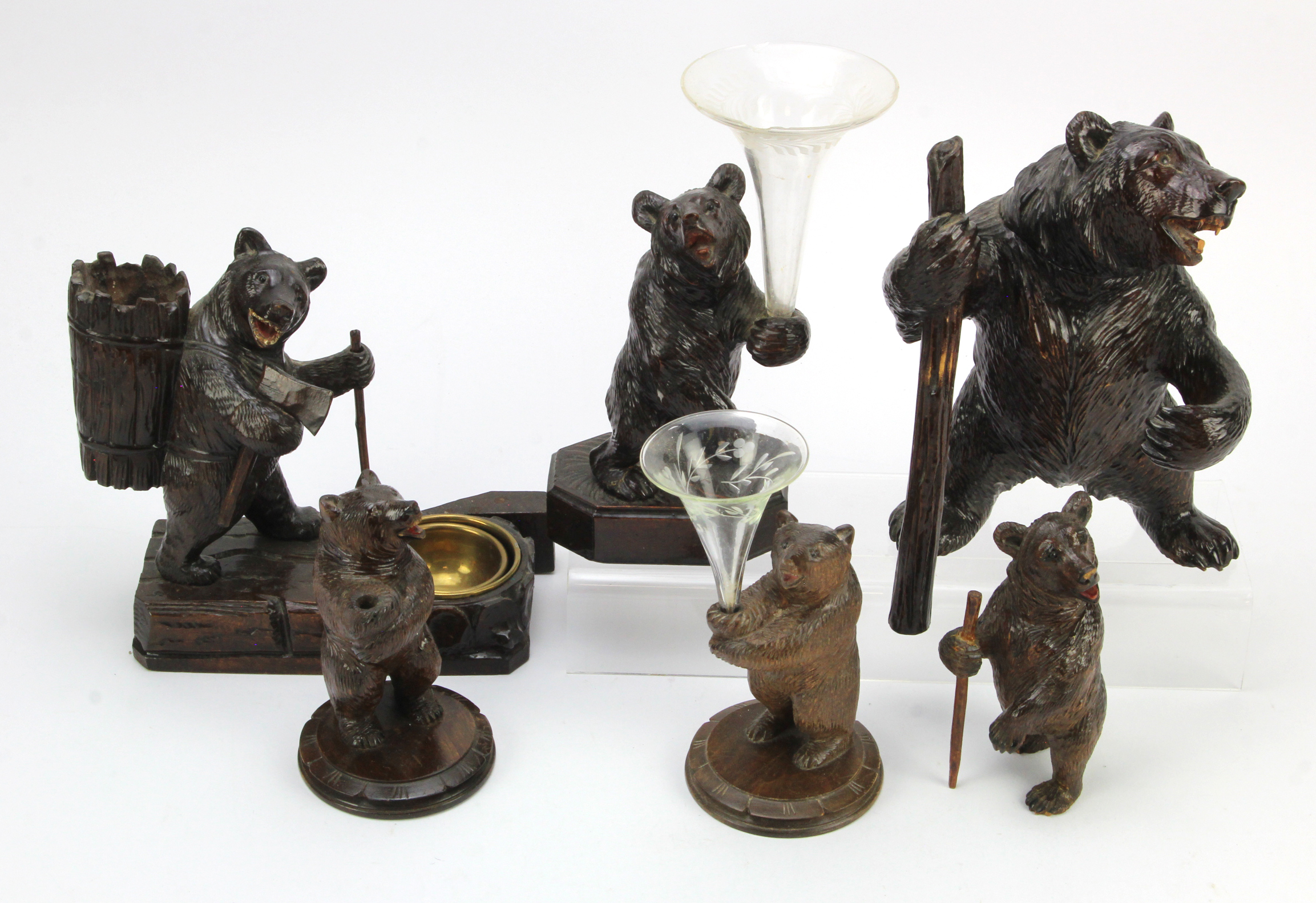 Black Forest. A group of six Black Forest bears, two holding glass vases, tallest 22cm approx.