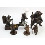 Black Forest. A group of six Black Forest bears, two holding glass vases, tallest 22cm approx.